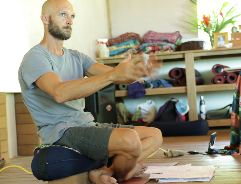 Man teaching 300 hour yoga teacher training class